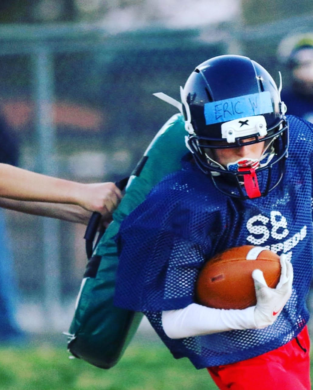 Spring Tackle Development Practice — youth athlete running through contact